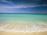 Collection Clear Blue Water And Wispy Clouds Along The Beach at Cancun